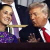 President Trump leans over to talk to Mexican President Claudia Sheinbaum.