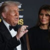 Donald and Melania Trump on red carpet for Kennedy Center Honors. Trump in a tux and Melania in a black gown.