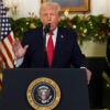 President Trump behind a White House podium, with Christmas garland and an American flag behind him, gestures with his right hand.