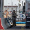 A Texas Department of Public Safety trooper inspects a commercial truck at a border crossing.