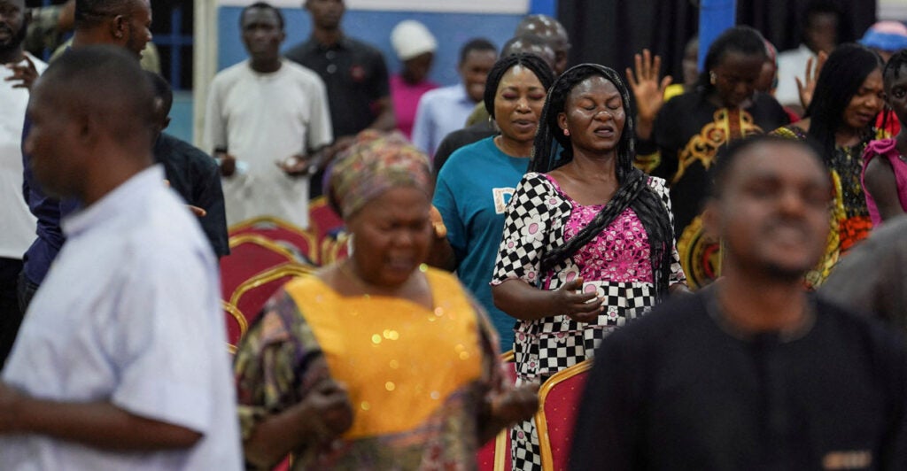 Christian worshippers pray in Nigeria.