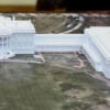 An overhead view of a model of the White House with new ballroom.