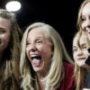 A laughing Abigail Spanberger, flanked by her three daughters.