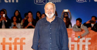 A smiling Rob Reiner at the premiere of his film 