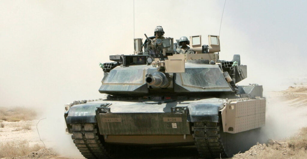 An M1A1 Abrams tank rumbles outside Baghdad.
