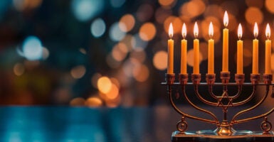 Close-up of illuminated candles on table, Seattle, Washington, United States, USA - stock photo