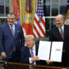 WASHINGTON, DC - DECEMBER 11: U.S. President Donald Trump displays a signed executive order as (2nd L-R) U.S. Sen. Ted Cruz (R-TX), Commerce Secretary Howard Lutnick and White House artificial intelligence (AI) and crypto czar David Sacks look on in the Oval Office of the White House on December 11, 2025 in Washington, DC. The executive order curbs states' ability to regulate artificial intelligence, something for which the tech industry has been lobbying.