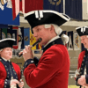A member of the U.S. Army Old Guard Fife and Drum Corps rehearses off-stage before a performance at an event unveiling semiquincentennial coin designs, The ceremony was held Dec. 10 at the National Constitution Center in Philadelphia.