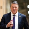 Ronny Jackson walks through a capitol hallway