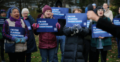 Supporters attend a rally outside the federal courthouse where a federal appeals court will consider whether U.S. President Donald Trump's administration may implement a provision that would deprive Planned Parenthood and its members of Medicaid funding, in Boston, Massachusetts, U.S., November 12, 2025. REUTERS/Brian Snyder