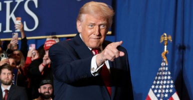 President Donald Trump points during a rally. He suggested he supports Sen. Mike Crapo's alternative to Obamacare subsidies.