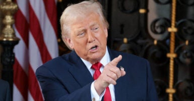 President Donald Trump speaks to reporters in Palm Beach, Florida.