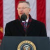 Veterans Affairs Secretary Doug Collins speaks at a podium in front of American flag.