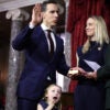 Sen. Josh Hawley is sworn in, as his wife holds the Bible and daughter makes a face.