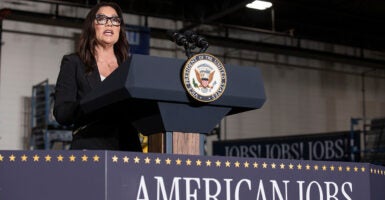 Labor Secretary Lori Chavez-DeRemer speaks at a podium.