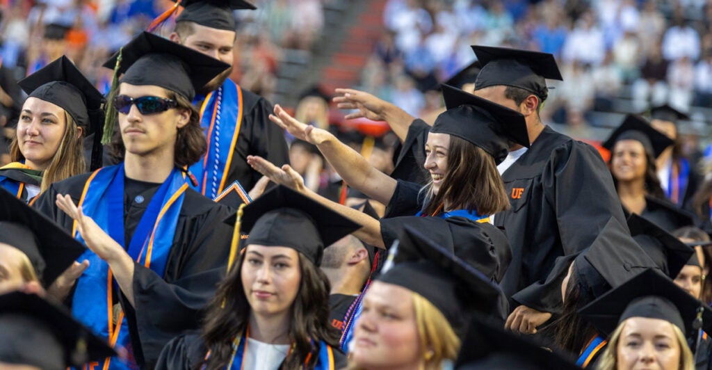 Students at Florida Gator graduation ceremony.