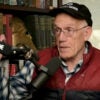 Victor Davis Hanson speaks into a microphone on his podcast set.