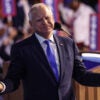 Tim Walz with his arms outstretched at DNC convention.