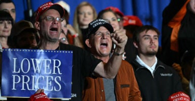 Attendees react as US President Donald Trump delivers remarks on the economy at Mount Airy Casino Resort in Mount Pocono, Pennsylvania, on December 9, 2025. (Photo by ANDREW CABALLERO-REYNOLDS / AFP via Getty Images)