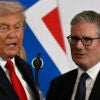 US President Donald Trump stands next to Britain's Prime Minister Keir Starmer as he delivers a statement during a summit on Gaza in Sharm el-Sheikh on October 13, 2025. Trump landed in Egypt on October 13 for a summit on Gaza, following a lightning visit to Israel after a ceasefire he brokered entered into force. (Photo by Khaled DESOUKI / AFP) (Photo by KHALED DESOUKI/AFP via Getty Images)