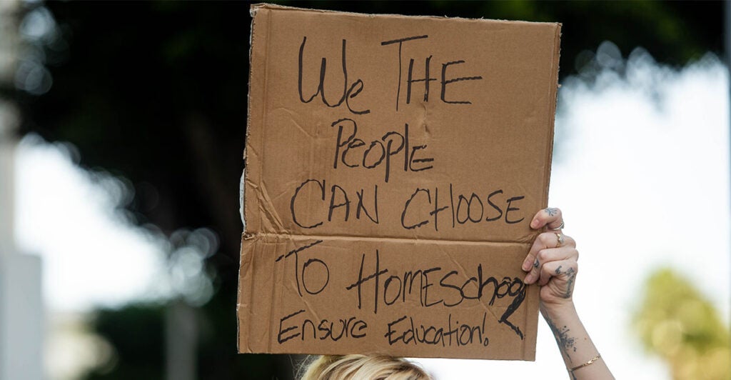 Los Angeles, CA - September 09:Vivian, of Los Angeles, who homeschools two children, protests at LAUSD Headquarters in Los Angeles the school board voting in a student COVID-19 vaccine mandate for children 12 and up on Thursday, September 9, 2021. (Photo by Sarah Reingewirtz/MediaNews Group/Los Angeles Daily News via Getty Images)