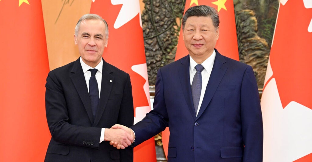 Chinese President Xi Jinping shakes hands with Canadian Prime Minister Mark Carney at the Great Hall of the People in Beijing, capital of China,