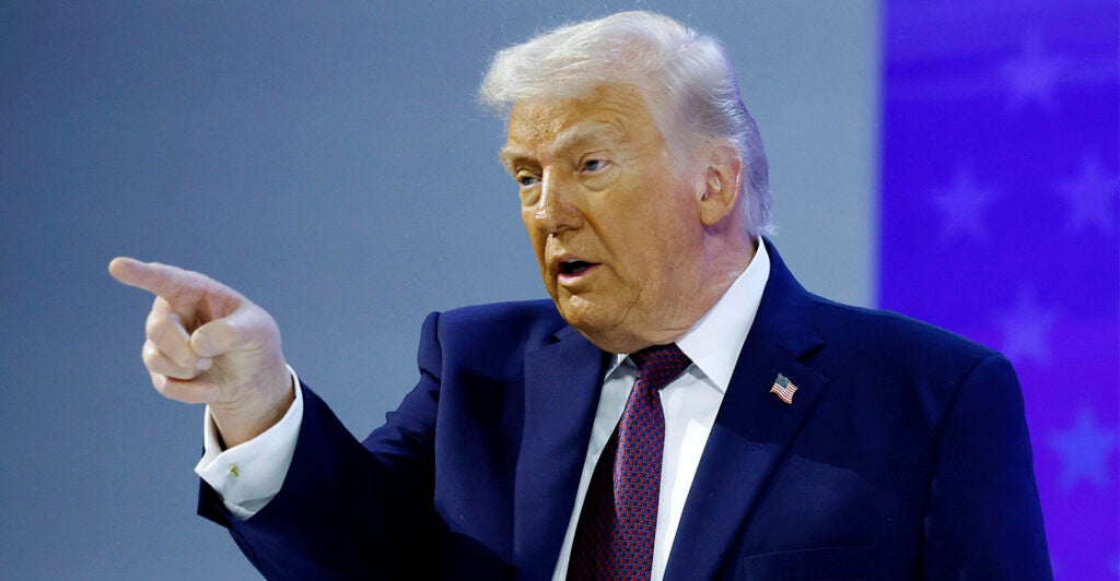 DAVOS, SWITZERLAND - JANUARY 22: U.S. President Donald Trump gestures after holding a signing ceremony for the “Board of Peace” at the World Economic Forum (WEF) on January 22, 2026 in Davos, Switzerland. The US-backed “Board of Peace” is intended to administer the fragile ceasefire in the Gaza Strip after the war between Israel and Hamas. The final makeup of the board has not been confirmed. (Photo by Chip Somodevilla/Getty Images)