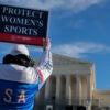 WASHINGTON, DC - JANUARY 13: Protesters against transgender athletes competing in women's sports gather outside the Supreme Court on January 13, 2026 in Washington, DC. Groups from both sides of the debate gathered on Tuesday morning to protest while two cases that prohibit transgender girls from joining girls' and women's sports teams are heard inside the Supreme Court. Heather Diehl/Getty Images