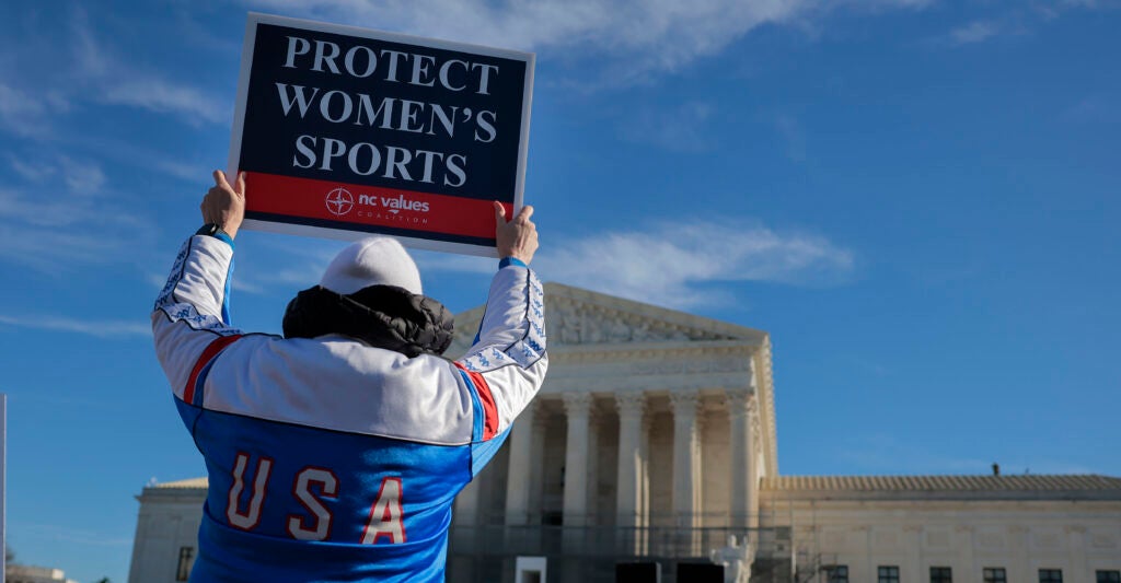WASHINGTON, DC - JANUARY 13: Protesters against transgender athletes competing in women's sports gather outside the Supreme Court on January 13, 2026 in Washington, DC. Groups from both sides of the debate gathered on Tuesday morning to protest while two cases that prohibit transgender girls from joining girls' and women's sports teams are heard inside the Supreme Court. Heather Diehl/Getty Images