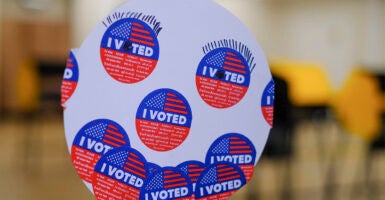 A detail view shows a smiling face made from ''I Voted'' stickers during early in-person voting for the California Statewide Special Election on October 29, 2025, in Los Angeles, California. Voters head to the polls on Tuesday, November 4, 2025, to vote Yes or No on Proposition 50, which implements a new congressional map for the next three election cycles in California. (Photo by Michael Yanow/NurPhoto via Getty Images)
