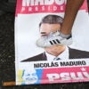 An opponent of Venezuelan President Nicolas Maduro's government steps on an election campaign poster with the image of Maduro during a protest at the Petare neighborhood in Caracas on July 29, 2024, a day after the Venezuelan presidential election. President Nicolas Maduro was declared the winner of Venezuela's presidential election but the opposition and key regional neighbours immediately rejected the official results. (Photo by Raul ARBOLEDA / AFP) (Photo by RAUL ARBOLEDA/AFP via Getty Images)