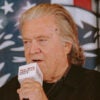 Steve Bannon speaks into a microphone.