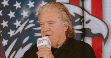 Steve Bannon speaks into a microphone.