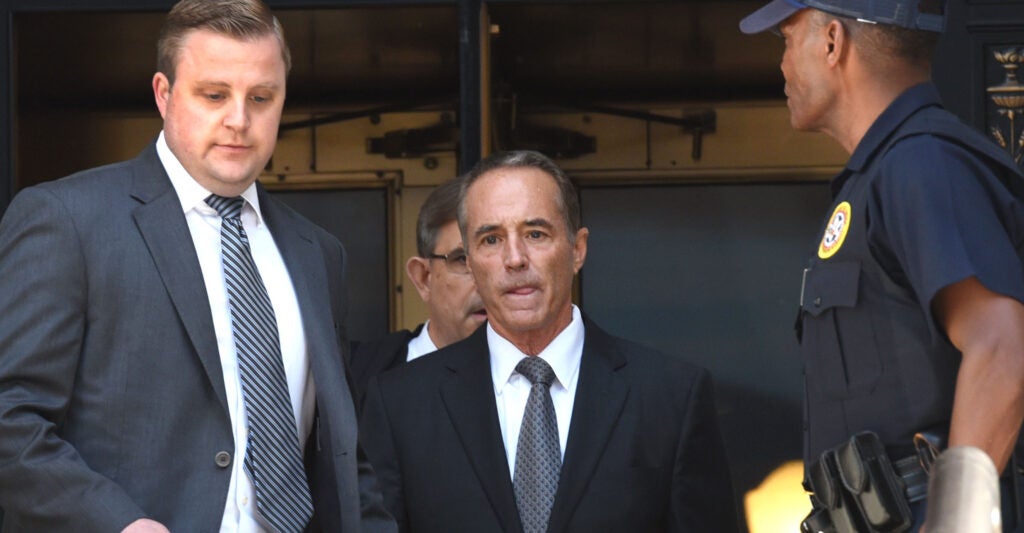 US Representative Chris Collins (C), a leaves US Federal Court in New York on after being indicted on insider trading.