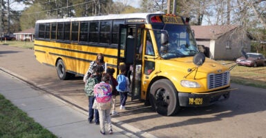 Children leave Wilkins Elementary school in in Jackson, Mississippi, on March 24, 2022, because os a lack of the water pressure. - Every morning, 180 students at a school in Jackson, Mississippi have to board a bus to be taken to another nearby school. The reason? Their school lacks the water pressure needed to flush its own toilets. Cheryl Brown, the principal at Wilkins Elementary, where 98 percent of the 400 students are African-American and most come from underprivileged backgrounds, doesn't hide her frustration. (Photo by Francois PICARD / AFP) (Photo by FRANCOIS PICARD/AFP /AFP via Getty Images)