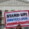 Demonstrator with voting rights sign at Supreme Court of the United States on March 24, 2025.