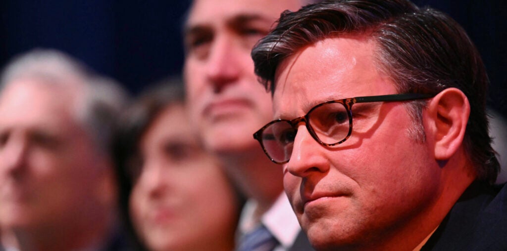 Speaker of the House Mike Johnson attends President Donald Trump's speech.