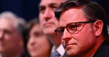 Speaker of the House Mike Johnson attends President Donald Trump's speech.