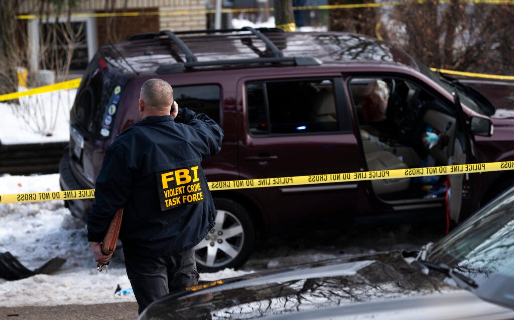 MINNEAPOLIS, MINNESOTA - JANUARY 07: Members of law enforcement work the scene following a suspected shooting by an ICE agent during federal law enforcement operations on January 07, 2026 in Minneapolis, Minnesota. According to federal officials, the agent, "fearing for his life" killed a woman during a confrontation in south Minneapolis. (Photo by Stephen Maturen/Getty Images)