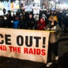 Protesters march against ICE after an ICE agent shot Renee Nicole Good, a member of an ICE Watch group.