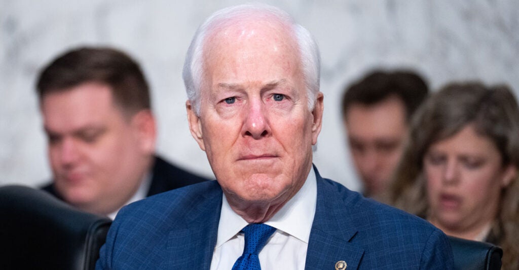 Senator John Cornyn sits in a senate hearing