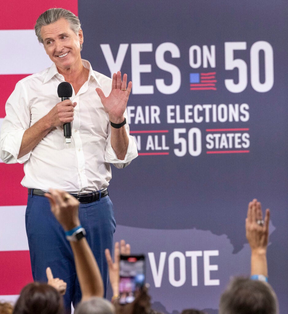 California Governor Gavin Newsom speaks at a "Yes On Prop 50" volunteer event .