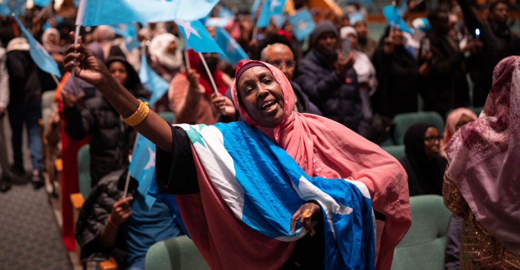 MINNEAPOLIS, MN. - DECEMBER 2022: Sawo Kwao sang and waved the Somali flag Thursday night, December 15, 2022 as a DJ played Somali pop music for the crowd in the auditorium of the Minneapolis Convention Center awaiting the arrival of Somali President Hassan Sheikh Mohamud. Somali President Hassan Sheikh Mohamud is in town to address the members of the Somali community, the largest outside Africa, after attending the U.S. - Africa Leaders Summit in Washington, D.C. this week. (Photo by Jeff Wheeler/Star Tribune via Getty Images)