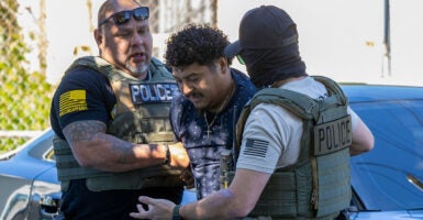 WASHINGTON, DC - AUGUST 30: ICE Enforcement and Removal Operations arrest a man they chased several blocks for an unknown reason on Georgia Avenue on August 30, 2025 in Washington, DC. An increased presence of law enforcement has been seen throughout the nation's capital since U.S. President Donald Trump announced plans to deploy federal officers and the U.S. National Guard. (Photo by Tasos Katopodis/Getty Images)
