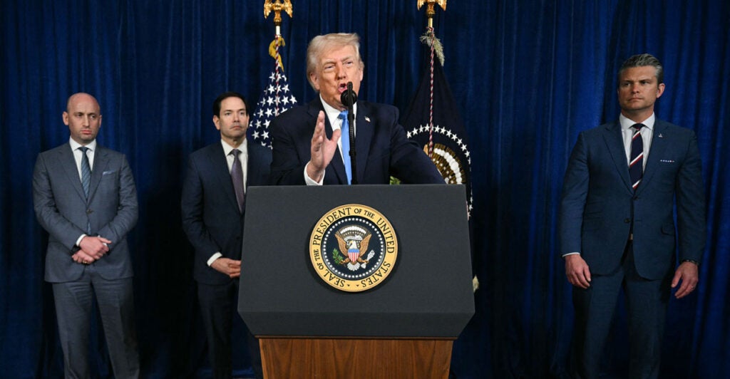 TOPSHOT - US President Donald Trump, alongside (L/R) Deputy Chief of Staff Stephen Miller, Secretary of State Marco Rubio, and US Secretary of Defense Pete Hegseth, speaks to the press following US military actions in Venezuela, at his Mar-a-Lago residence in Palm Beach, Florida, on January 3, 2026. President Trump said Saturday that US forces had captured Venezuelan leader Nicolas Maduro after launching a "large scale strike" on the South American country. (Photo by Jim WATSON / AFP via Getty Images)