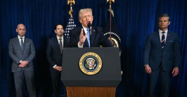 TOPSHOT - US President Donald Trump, alongside (L/R) Deputy Chief of Staff Stephen Miller, Secretary of State Marco Rubio, and US Secretary of Defense Pete Hegseth, speaks to the press following US military actions in Venezuela, at his Mar-a-Lago residence in Palm Beach, Florida, on January 3, 2026. President Trump said Saturday that US forces had captured Venezuelan leader Nicolas Maduro after launching a "large scale strike" on the South American country. (Photo by Jim WATSON / AFP via Getty Images)