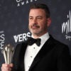 TV host Jimmy Kimmel poses in the press room with the Best Talk Show award for "Jimmy Kimmel Live!" during the 31st Annual Critics Choice Awards at Barker Hangar in Santa Monica, California, on January 4, 2026. (Photo by Michael Tran / AFP via Getty Images)