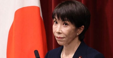 Japan's Prime Minister Sanae Takaichi reacts while addressing a press conference at the Prime Minister's Office in Tokyo on January 19, 2026. Takaichi said on January 19 she would dissolve parliament this week ahead of a snap election on February 8, hoping for a stronger mandate to push through her ambitious policy agenda. (Photo by Rodrigo Reyes Marin / POOL / AFP via Getty Images)