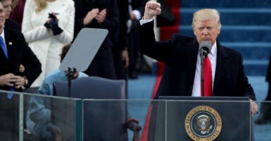 JANUARY 20: President Donald Trump raises a fist after his inauguration on the West Front of the U.S. Capitol on January 20, 2017 in Washington, DC. In today's inauguration ceremony Donald J. Trump becomes the 45th president of the United States. (Photo by Alex Wong/Getty Images)