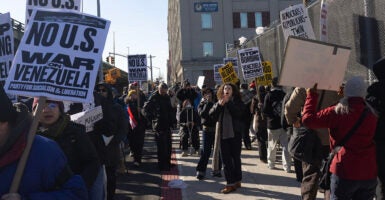 Protesters rally against President Donald Trump's extradition of Nicolas Maduro from Venezuela. Asra Nomani has described the groups organizing the protests as a potential foreign influence campaign.